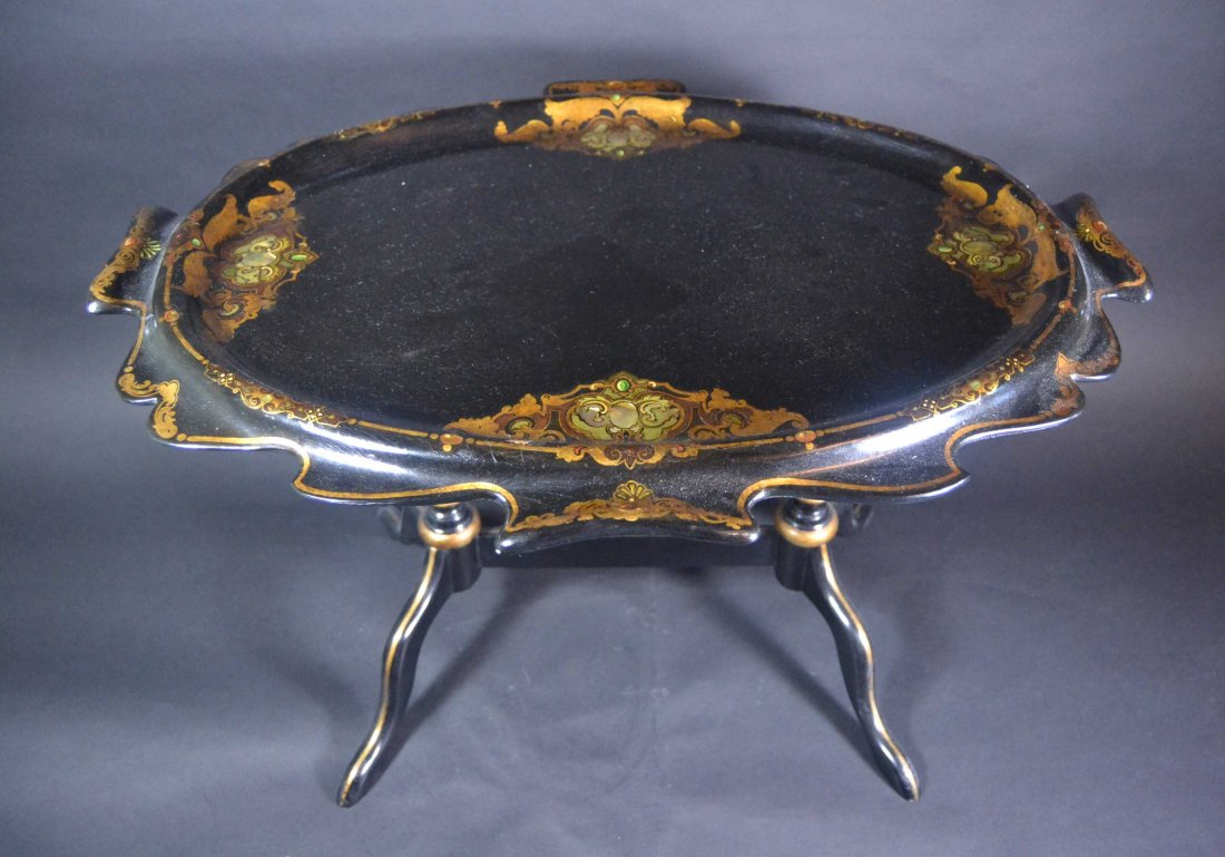 Tray, Tilting Stand, Black Lacquer/Abalone C1870: Description: Tilting Tray on Stand. Black lacquer tray having inlays of abalone with gilt decoration on papier mache. A slide bolt releases the tray to tilt for display purposes, a later addition. Tra