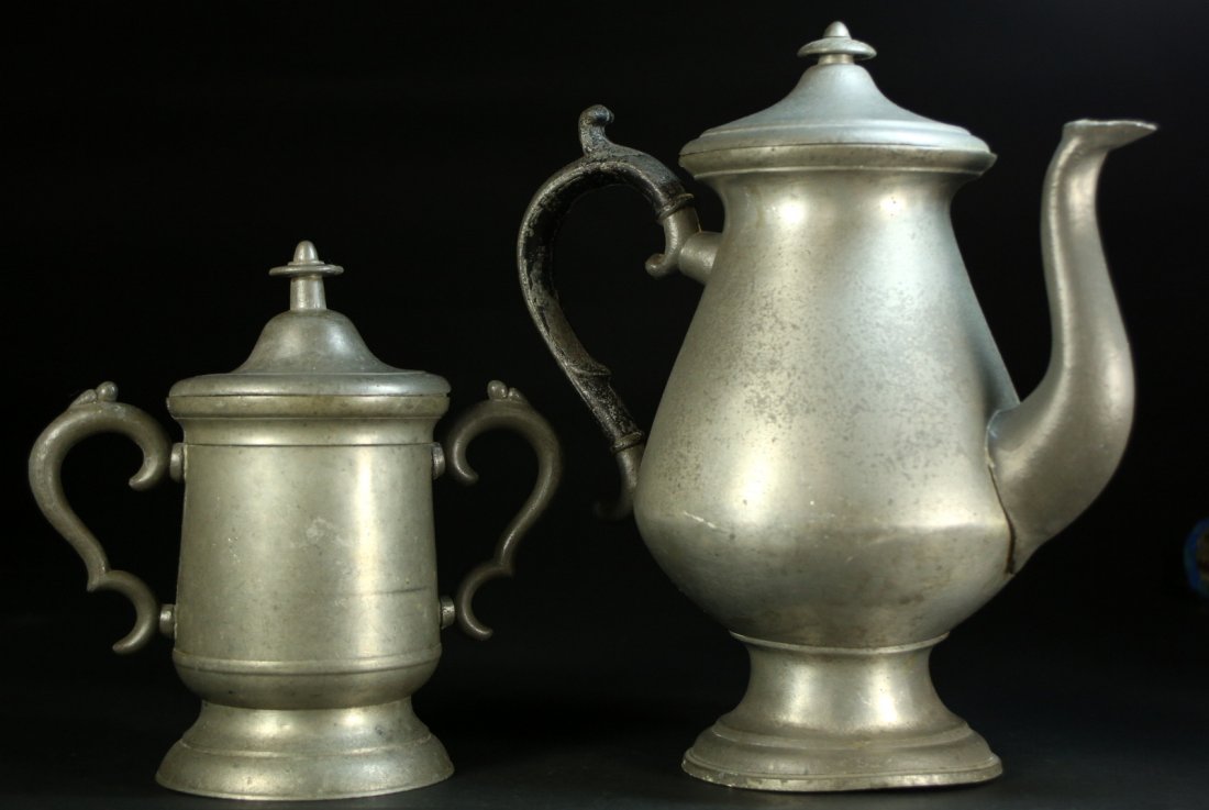 (2) Antique American Pewter Coffee Pot/Canister: Description: 1. Antique American pewter coffee pot with ebonized handle,marked savage and No. 95 on the bottom. 11 inches high.2. American pewter covered, 2-handled sugar canister. 7 5/8" high. Materi