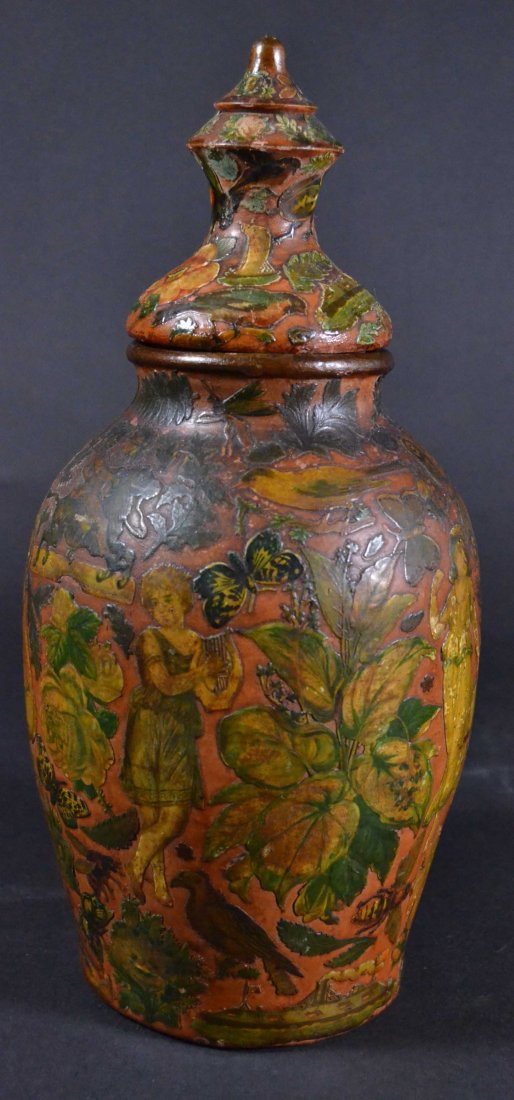 Redware jar with decoupage. Circa 1920: Description: Redware jar with later decoupage overlaid chromoliths under varnish, decoration of diverse plants, flowers, roses, variety of birds, bees, butterflies, scarab and various images of boy a