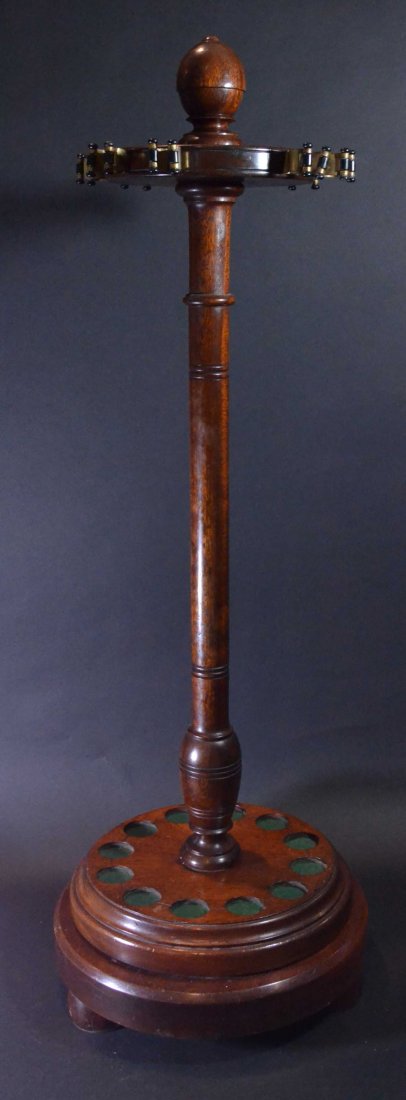 Pool Cue Stand, mahogany, revolving, c1880: Description: Turned mahogany post with brass clips holding turned ebony retainers attached at the top for securing sticks.. Can be also used for cane or Sunday stick display. Material: Wood Maker/Arti