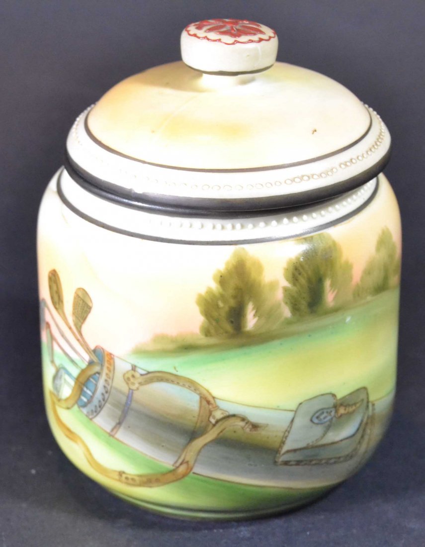 Golf, Jar w/Lid, porcelain Nippon, hand-painted: Description: A covered jar, in a golf theme. With a hand painted design of a golf bag. Has a mark from Nippon on the bottom Material: Porcelain Maker/Artist: Nippon Date: 20th century Provenance: n/
