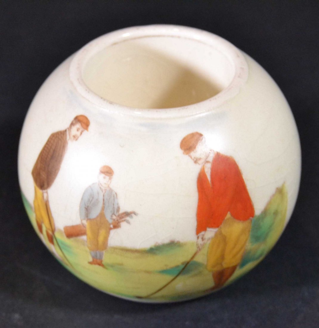 Golf Inkwell Carlton Ware: Description: An inkwell in a golf theme from Carlton ware, has a scene of golfers on the green. Material: earthenware Maker/Artist: Carlton Ware Date: Circa 1910 Provenance: n/a Size of Artwo