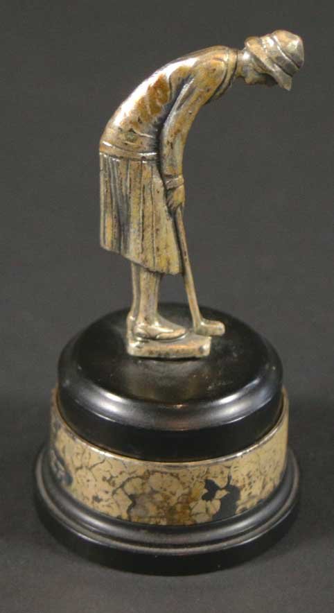 Golf, lowest score, trophy, 1936: Description: A golf trophy, for the lowest score. Awarded in 1936. Material: SIlver plate Maker/Artist: Unknown Date: 1936 Provenance: n/a Size of Artwork: H. 3.5 x W. 1 x D. 2 in