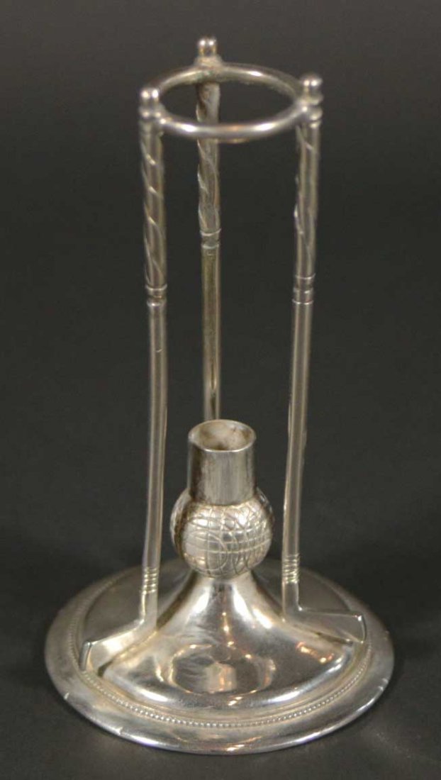 Golf Hatpin Stand, cushion missing, no hatpins: Description: Hat pins with holder, pin cushion with golf clubs surrounding it. Material: Silver plate Maker/Artist: Unknown Date: Circa 1900 Provenance: n/a Size of Artwork: H. 5 x W. 2.5