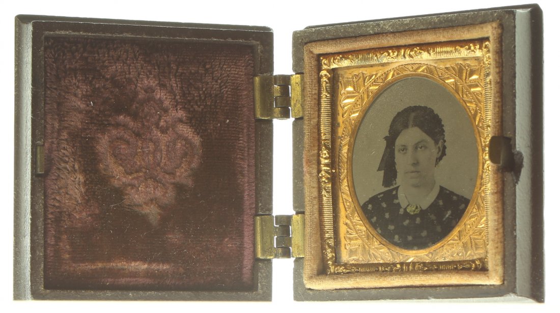 1/16 plate ambrotype: Description: Plate Size: 1/16 platePhoto type: AmbrotypePhotographer: Unknown Hand Coloration: Cheeks/gilt Subject Matter: WomanCase Name: The Meditating MonkCase Type/Maker: Littlefield, Parsons & Co