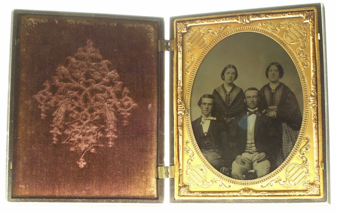 1/2 plate ambrotype: Description: Plate Size: ½ platePhoto type: AmbrotypePhotographer: Unknown Hand Coloration: Cheeks/giltSubject Matter: Two women two menCase Name: The English PioneersCase Type/Maker: Littlefield, Pa
