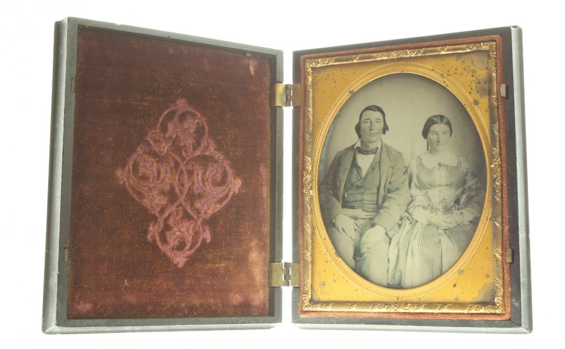 1/4 plate ambrotype: Description: Plate Size: 1/4 platePhoto type: AmbrotypePhotographer: Unknown Hand Coloration: noneSubject Matter: Couple seatedCase Name: Cupid and the Wounded StagCase Type/Maker: A. P. Critchlow & C