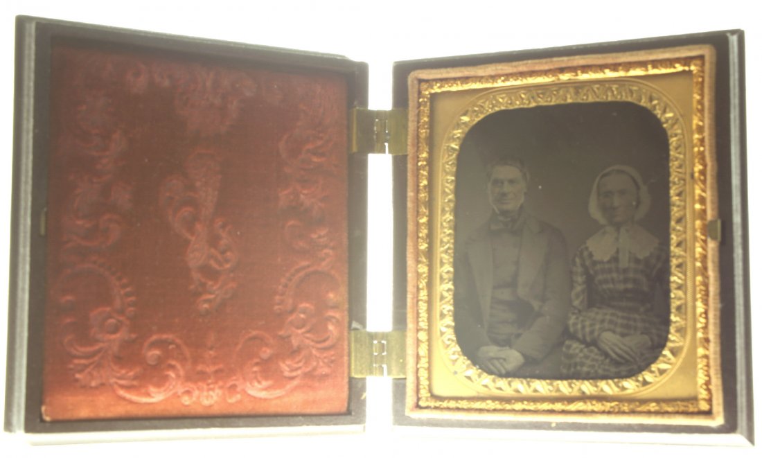1/6 plate ambrotype: Description: Plate Size: 1/6 platePhoto type: AmbrotypePhotographer: Unknown Hand Coloration: Cheeks/giltSubject Matter: Elderly CoupleCase Name: Scroll Motif with Diapered CenterCase Type/Maker: A. P