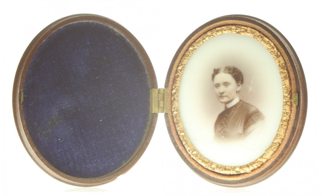 1/9 oval plate ambrotype: Description: Plate Size: 1/9 oval platePhoto type: Ambrotype on Milk GlassPhotographer: Unknown Hand Coloration: Entire image/giltSubject Matter: WomanCase Name: Mixed Fruit VariationCase Type/Maker: 