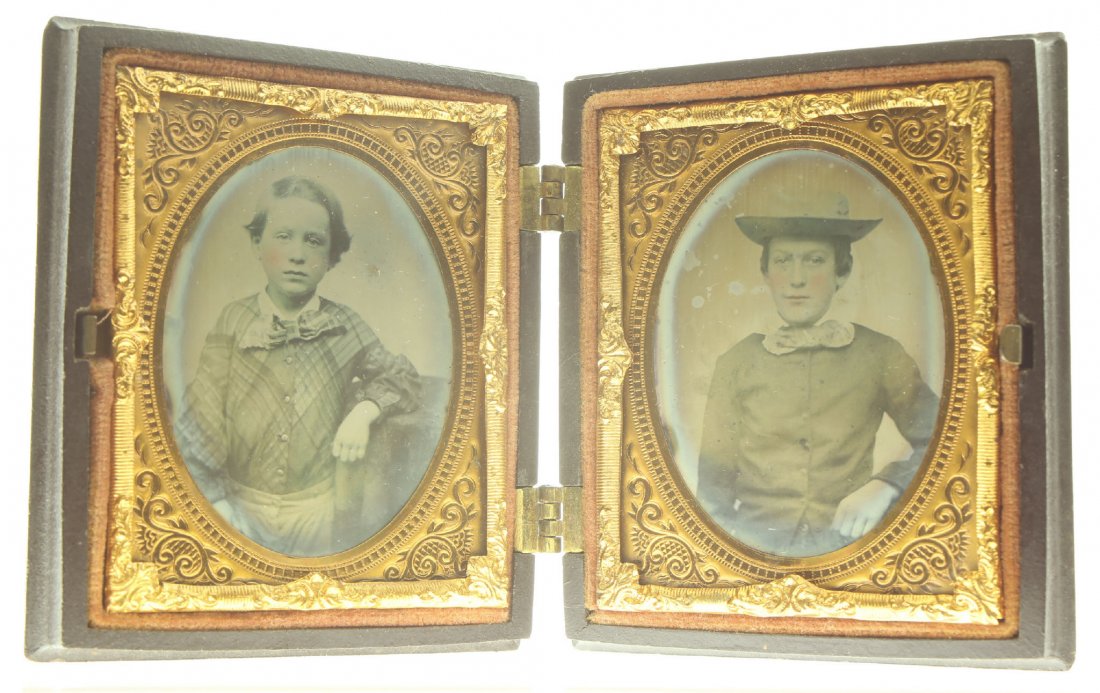 1/9 pair of plate ambrotype: Description: Plate Size: 1/9 pair of plates Photo type: AmbrotypePhotographer: Unknown Hand Coloration: Cheeks, hand/giltSubject Matter: Boy and WomanCase Name: Bird with Open WingsCase Type/Maker: Li