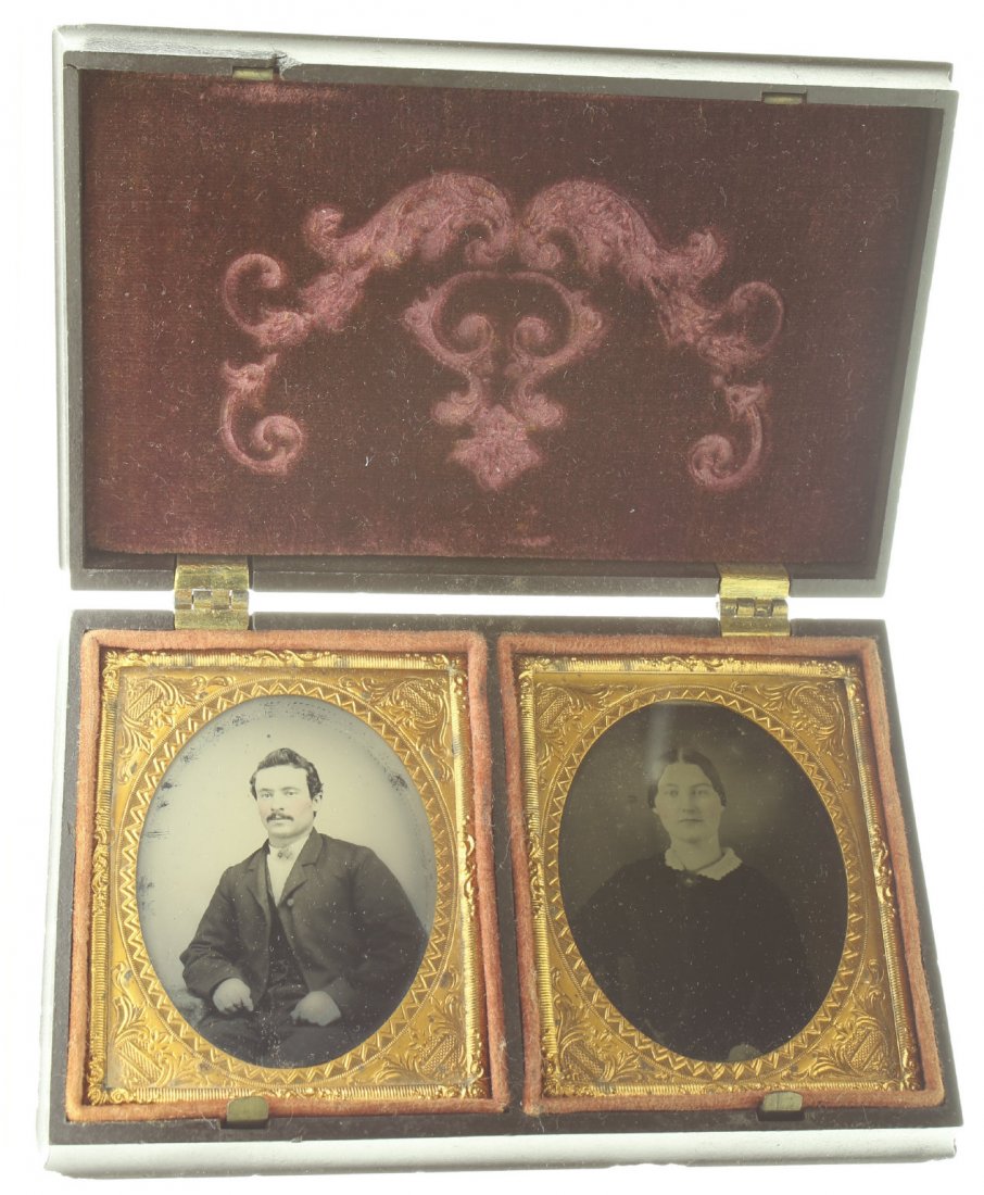 1/9 pair of plates ambrotype: Description: Plate Size: 1/9 pair of plates Photo type: AmbrotypePhotographer: Unknown Hand Coloration: Cheeks/giltSubject Matter: Man and womanCase Name: Children Playing with ToysCase Type/Maker: Li