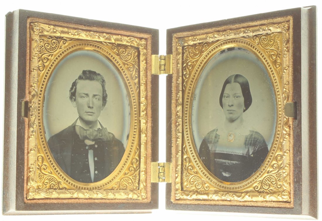 1/9 pair of plates ambrotype: Description: Plate Size: 1/9 pair of plates Photo type: AmbrotypePhotographer: Unknown Hand Coloration: Cheeks and accessories/giltSubject Matter: Man and womanCase Name: Angel Scattering RosesCase Ty