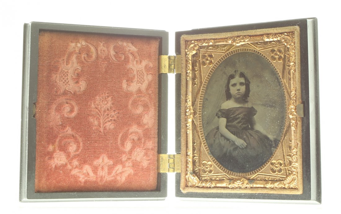 1/9 plate ambrotype: Description: Plate Size: 1/9 platePhoto type: AmbrotypePhotographer: Unknown Hand Coloration: Cheeks and arm/giltSubject Matter: Little girl seatedCase Name: Angel Scattering RosesCase Type/Maker: S. 