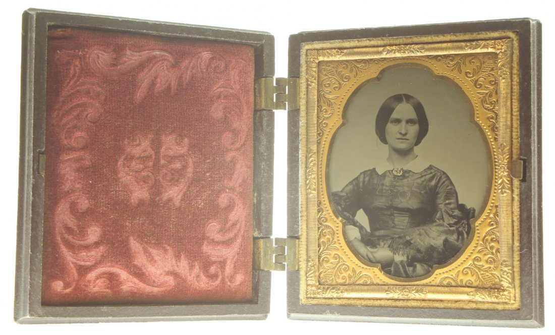 1/9 plate ambrotype: Description: Plate Size: 1/9 platePhoto type: AmbrotypePhotographer: Unknown Hand Coloration: Accessories/giltSubject Matter: Woman seatedCase Name: Assorted FlowersCase Type/Maker: Littlefield, Parso