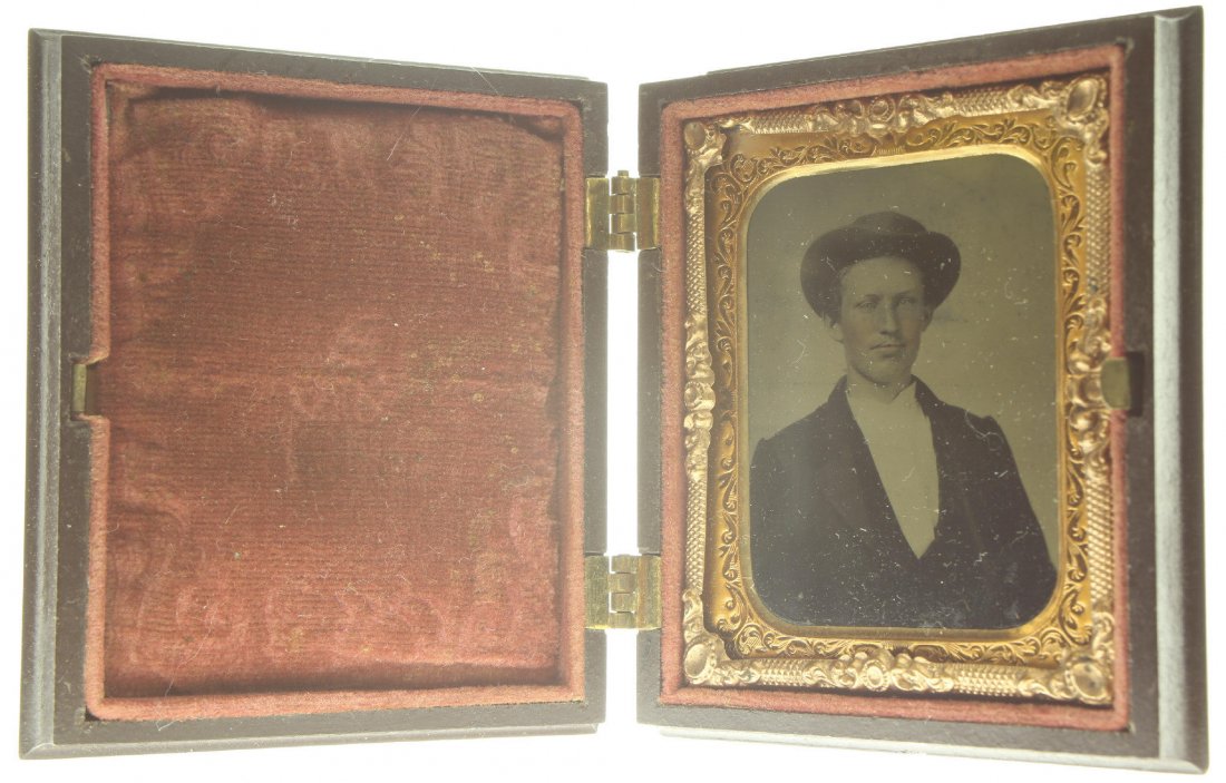 1/9 plate ambrotype: Description: Plate Size: 1/9 platePhoto type: AmbrotypePhotographer: Unknown Hand Coloration: Cheeks/giltSubject Matter: ManCase Name: Ornate Oval with PatternCase Type/Maker: UnknownDate of image: C.