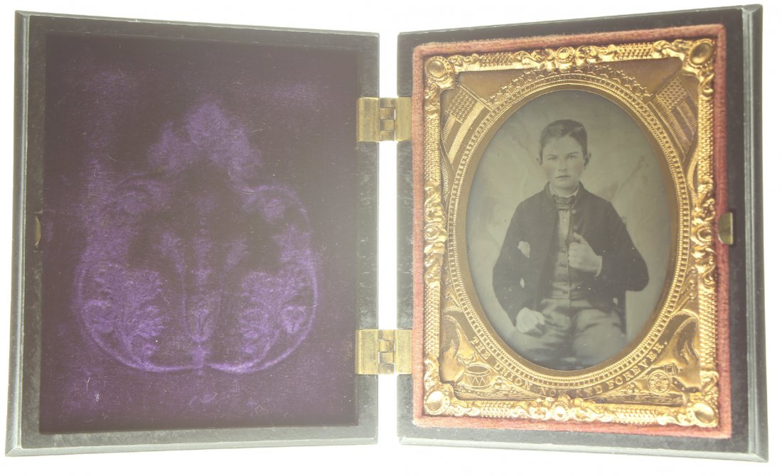 1/9 plate ambrotype: Description: Plate Size: 1/9 platePhoto type: AmbrotypePhotographer: Unknown Hand Coloration: Cheeks/giltSubject Matter: BoyCase Name: Accented OvalCase Type/Maker: UnknownDate of image: C. 1860Condit