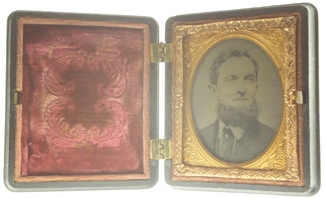 1/9 plate ambrotype: Description: Plate Size: 1/9 platePhoto type: AmbrotypePhotographer: Unknown Hand Coloration: Cheeks/giltSubject Matter: ManCase Name: The Camp SceneCase Type/Maker: Littlefield, Parsons & Co., Plasti