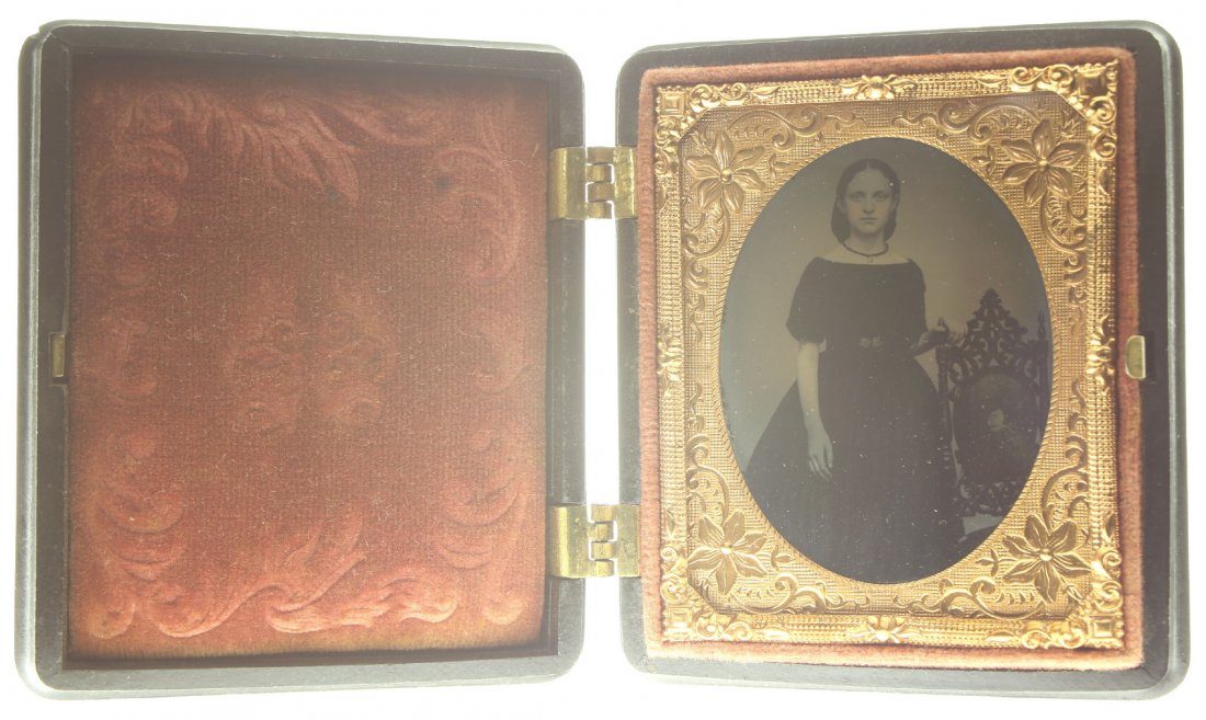 1/9 plate ambrotype: Description: Plate Size: 1/9 platePhoto type: AmbrotypePhotographer: Unknown Hand Coloration: Cheeks/giltSubject Matter: Young womanCase Name: Floral MotifCase Type/Maker: Littlefield, Parsons & Co., 