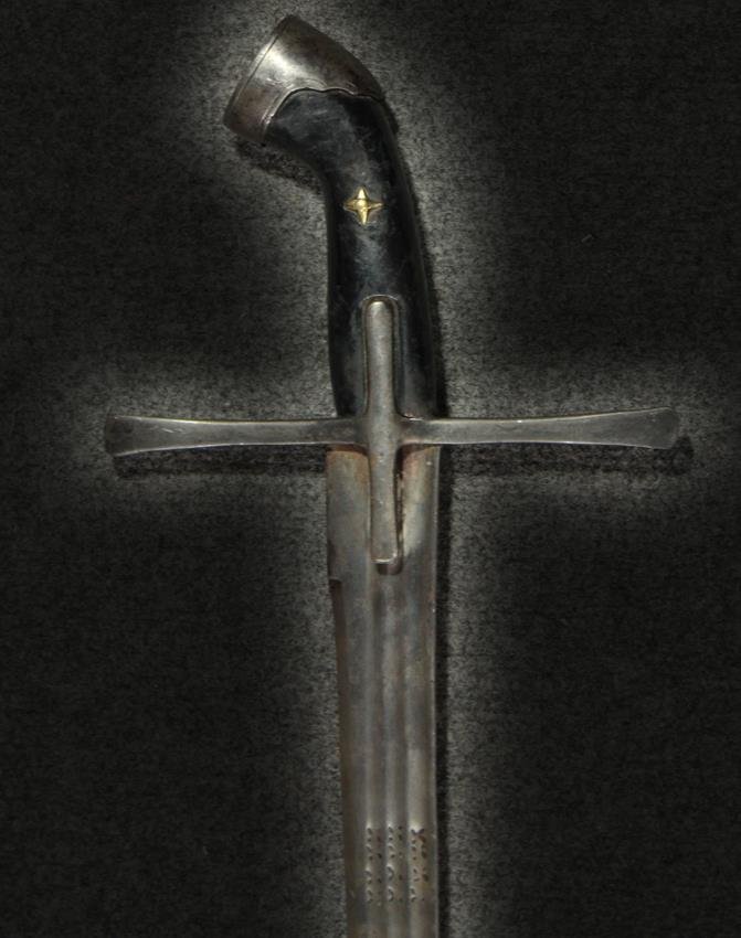 Sabre, Hungarian, Circa 1700: Description:Blade: Single edged to a double edged Blade length: 29.5 inches Markings: 12 ‘X’ marks on the blade at the hilt end Fuller: 3 fullers on the blade Cross guard: Cross style, steel br>Gr