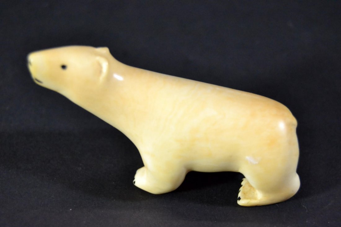 Bear, Whale tooth carving: Description: A carved polar bear from a whale tooth. Material: Whale tooth Maker/Artist: Unknown Date: 19th/20th century Provenance: n/a Size of Artwork: H. 2.75 x W. 1 x D. .50 in <br