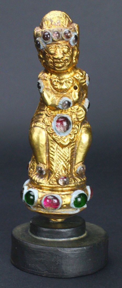 Statue, Gilt, Dagger Hilt, Indonesian, 20th C.: Category: Sculpture Description: This statue was once a hilt to a blade. It was cast in halves, but has several instances of hand application - noticed in the soldering and placement of the glass gems