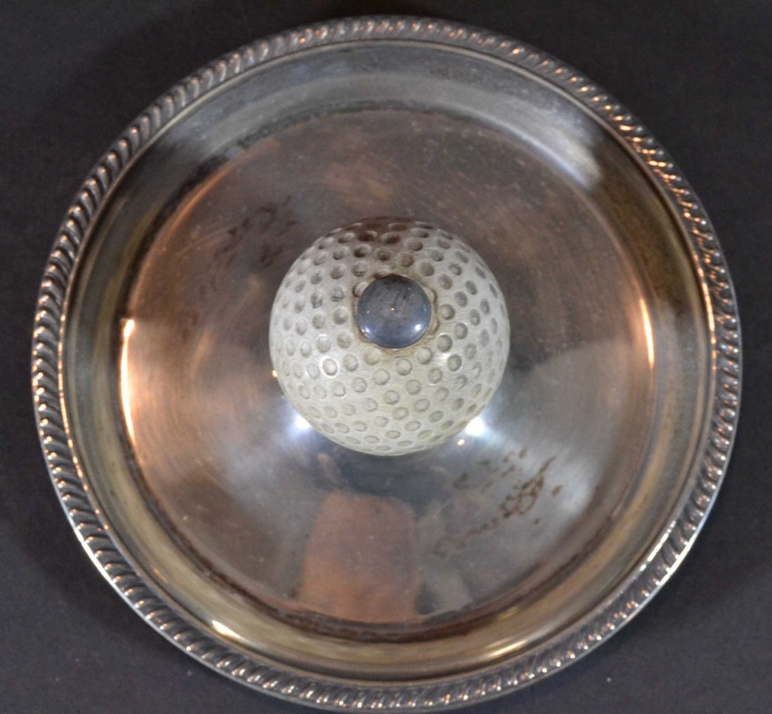 Golf Tray, Small Round w/Golf Ball Center, plated: Antique and Collectables Category: Sports Description: A silver plated ashtray in a golf theme, has golf ball in the center. Material: Silver plated Maker/Artist: Frank M. Whitting & Co. Date: Circa 1
