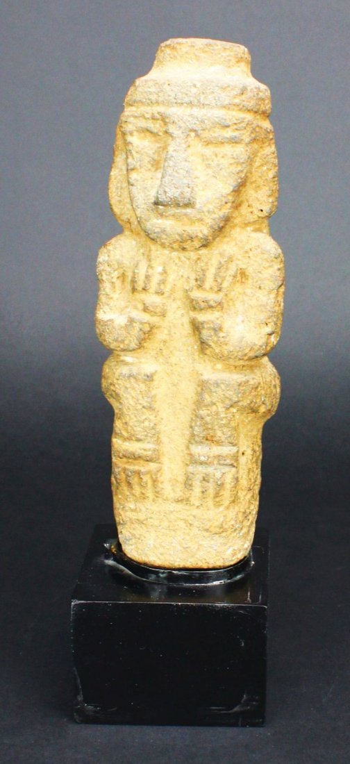 Effigy, Stone, Lava Rock, Mexican: Antique and Collectables Category: Pre-Columbian Description: This stone effigy was carved from cooled lava and then set upon a black-lacquered wood stand to present it. The figure is clearly Pre-Colu