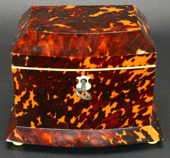 Mahogany, tortoise, bone box: Description: Veneers of tortoise shell and bone cover a structure of mahogany solids. Features include lids with turned knobs, turned bun feet, nicely shaped bone escutcheon, brass hardware is origina