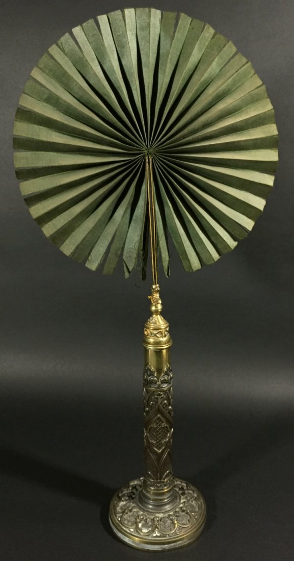 Gilt Bronze Candle Screen, C.1800: Description: Gilt-bronze candle screen, c. 1800. The silk fan is folded into a brass tube concealed in the base, decorated with pinnacles, quatrefoils and other gothic designs. History: N/A Provenance