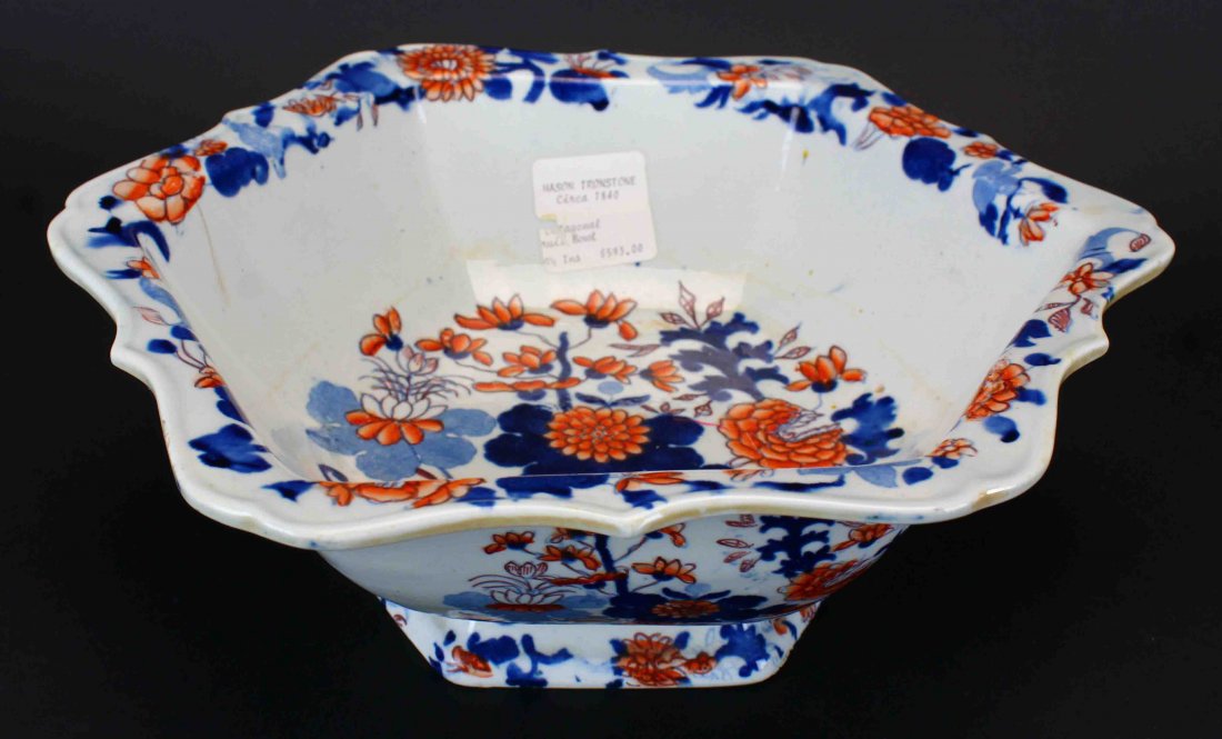 Imari Fruit Bowl, Mason's Ironstone: Description: Mason's ironstone fruit bowl in a hexagon shape. It is the flower and basket pattern on a pedestal. It is 4" high. History: Ironstone ware or most commonly just ironstone, is a type of vi