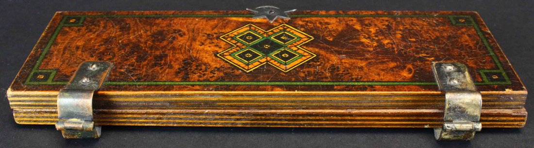 Tie Press, Lacquered Wood: Description: A wooden laminated tie press with geometric design, bordered in black and green lines. Chrome plated hinges and star shaped clasp with half ring closure. History: A tie press is a device,