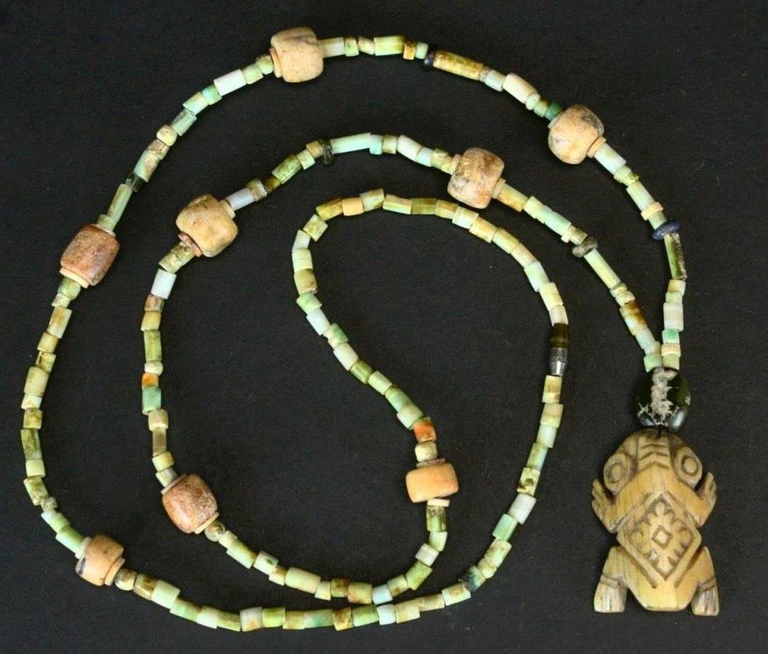 Pre-Columbian Mayan Necklace w Bone Pendant: Description: Necklace is a 30” strand of Mayan stones. Jade, turquoise and serpentine mix of calcite, alabaster and jade with bi-conical drilling. Beads are in a variety of shapes including the tubu