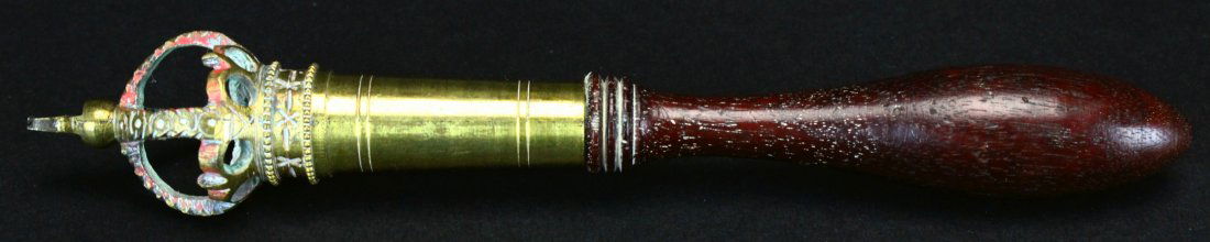 Tipstaff, Mahogany and brass: Description: Lacquered brass, heightened with red paint in the form of the crown of Great Britain. Scribe lines decorate the turned mahogany shaft. History: The Tipstaff is an officer of a court or, i