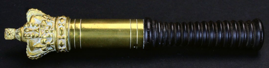 Tipstaff, Brass Crown, Barrel & Ebony Handle: Description: An example of a mid Victorian tipstaff carried by Police Inspectors in plain clothes. It has a brass crown and barrels with a turned ebony handle. The crown is solid brass. History: The e