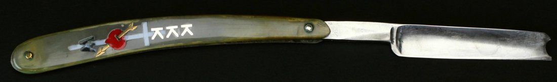 KKK Straight Razor: Description: A celluloid straight razor with 3" blade. One side of handle is "The Old English Razor". Opposite side has been personalized with KKK, a white cross and a red heart with a gold arrow thro
