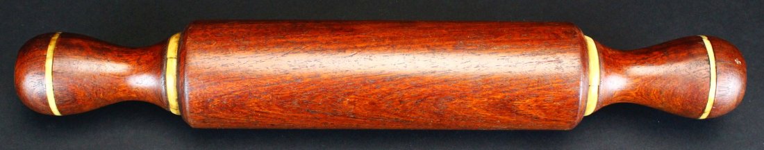 Scrimshaw Mahogany Rolling Pin: Description: Turned mahogany rolling pin with whale ivory accents. Likely American circa 1850. History: While the best-known form of scrimshaw is the whale tooth decorated with engraved scenes, scrims