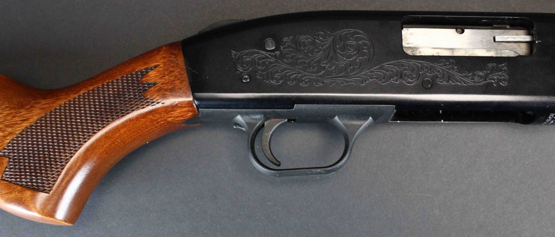 Mossberg Rifled 12 GA Shotgun + Extra Barrel: Description: 1995/97 vintage Mossberg 500A 12 gauge, 2 3/4" pump shotgun, with well executed, privately engraved receiver and two barrels. Currently fitted with a rifled and ported slug barrel with ad