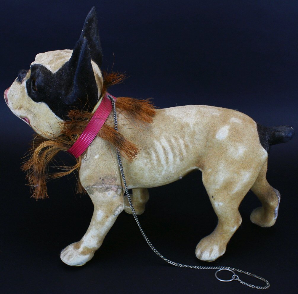 French Papier Mache Pull Toy Bulldog C 1890: Description: French 19th century growler dog on wheels. A paper mache French bull-dog with flocked finish in cream and black. Has good detailing, ribbing, glass eyes, nodding head, mouth that hinges o