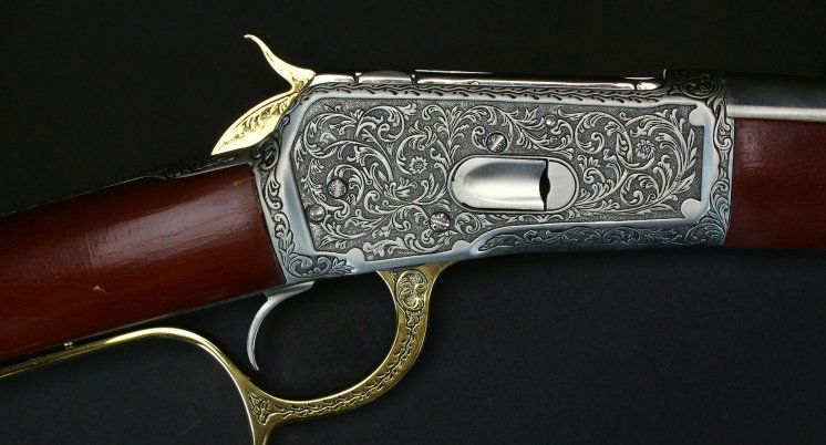 Franklin Mint, John Wayne, Winchester: Description: Non- firing replica of a Winchester M 1892 as used by John Wayne in moving picture films. Engraved, silver and gold plated piece mounted on a framed backboard. See history. History: Based