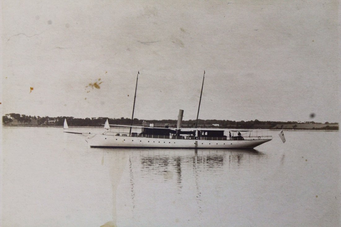 Photograph, Yacht, Gov. Jesse Metcalf, 1912: Description: This photograph depicts the yacht "Felicity," which was built and mastered by former Rhode Island Governor, Jesse Metcalf.It is sitting on still water, two figures visible at the bow. His