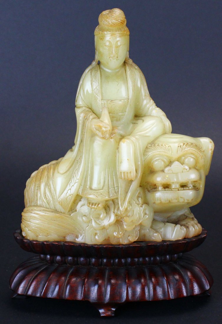 Guanyin on Lion, Soapstone, C. 1900: Description: This soapstone depiction of Guanyin, the East Asian spiritual figure, is depicted riding on the back of a lion. The statuette portrays Guanyin as a female and looks to be IndoChinese in o