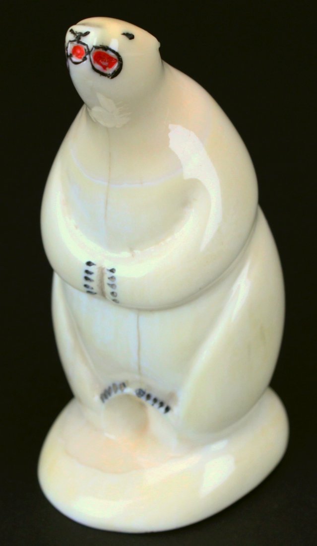 Whale Tooth, Polar Bear Carving: Description: A polar bear carving from antique whale's tooth. Claws and features painted in black and red. History: Ivory statue is the carving of ivory, that is to say animal tooth or tusk, by using 
