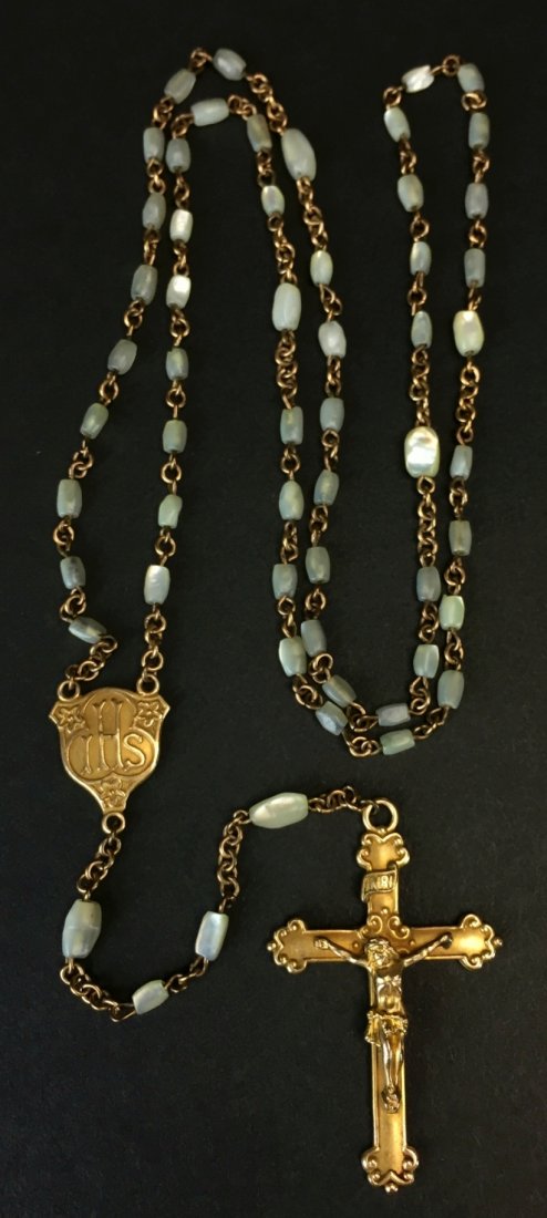 Rosary/ Gold Plated, Mother of Pearl: Description: A 16" gold plated rosary. Stamped WE twice in areas of gold plating. History: The rosary is a form of prayer used especially in the Catholic Church named for the string of prayer beads us