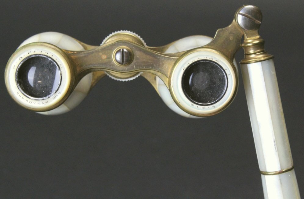 Brass and Mother of Pearl w Handle, Paris: Description: A pair of lacquered brass and mother of pearl opera glasses with an extended handle. W.A. Pfister Sheboygan hallmarked on the left eyepiece and Balland FT Paris on the right one. History: