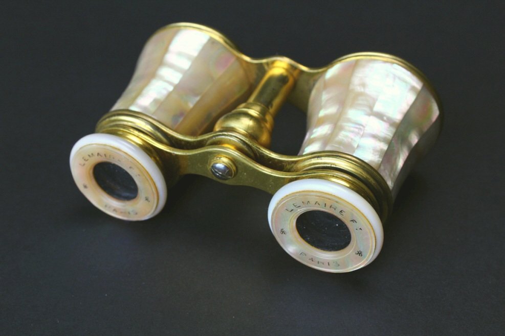 Brass and Mother of Pearl, Lemaire F, Paris: Description: A pair of gilded brass opera glasses with choice mother of pearl lined on the barrels and eye pieces. Hallmarked, "Lemaire F Paris" on the rime of eye pieces. History: The Lemaire firm wa