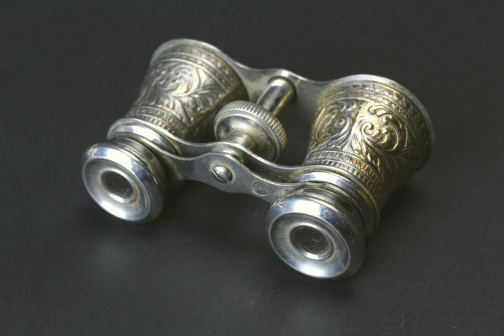 Cast Brass Opera Glasses, Occupied Japan: Description: A pair of nickel plated cast brass opera glasses. The underside of frame is marked, "MADE IN OCCUPIED JAPAN". A stamp of SAN in a circle is stamped on the framework above that. The body i