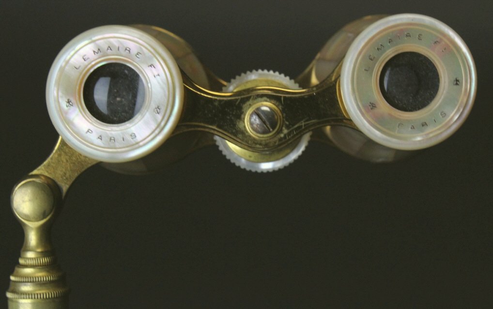 Gilded Brass and Mother of Pearl, Lemaire, Paris: Description: A pair of gilded brass and mother of pearl lorgnette opera glasses. The eyepieces are hallmarked, "Lemaire Ft Paris". History: The Lemaire firm was begun in 1846 in Paris, Rue Oberkampf. 