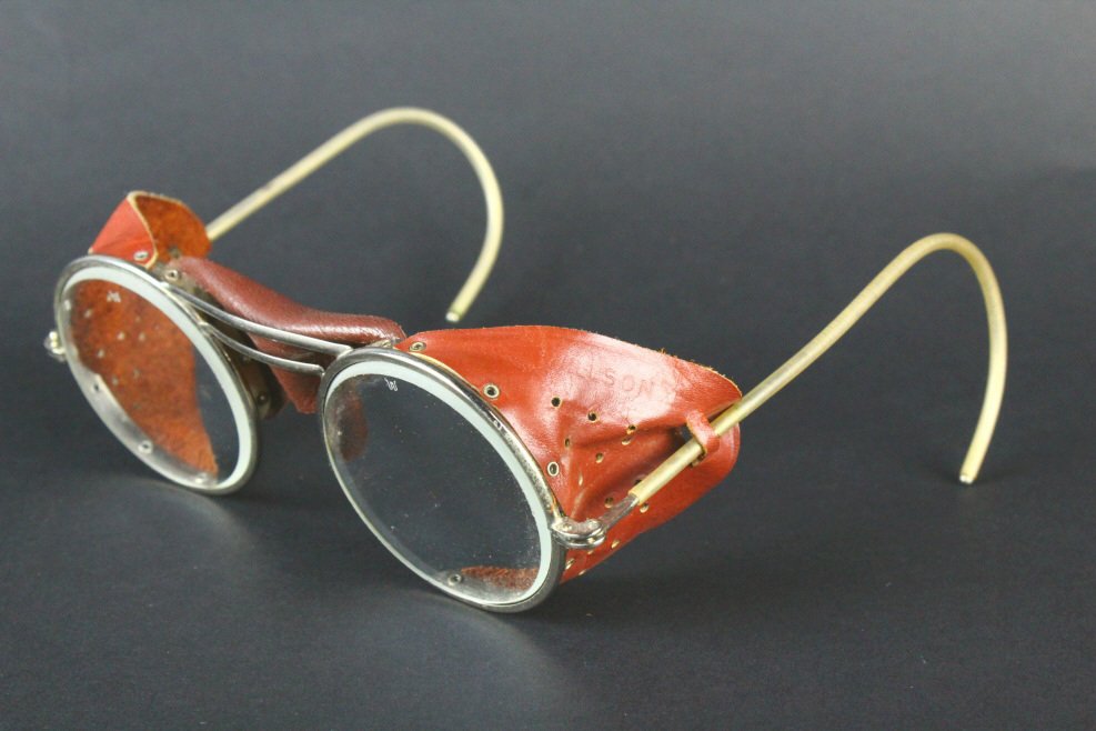 Motorcycle Riding Glasses, Wilson 1920: Description: A pair of 1920 Wilson motorcycle glasses. Leather side pieces stamped Made in US A Wilson. History: Gile J. Willson and his son Dr. Thomas A. Willson founded Thomas A. Willson & Co. in 18