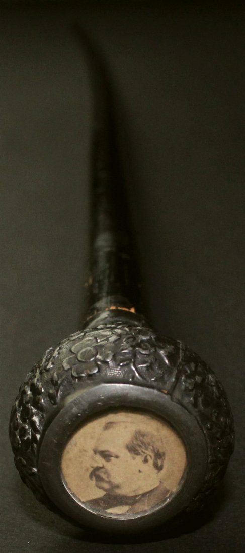 Cane, Political, Cleveland, C. 1893: This narrow campaign cane or walking stick has a silver topper in which there is a celluloid portrait of President Grover Cleveland.