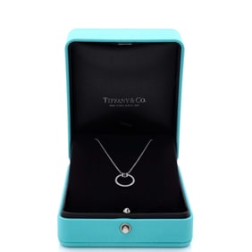 Tiffany & Co. T Circle Pendant Necklace 18K White Gold with Diamonds and Center Baguette Diamond